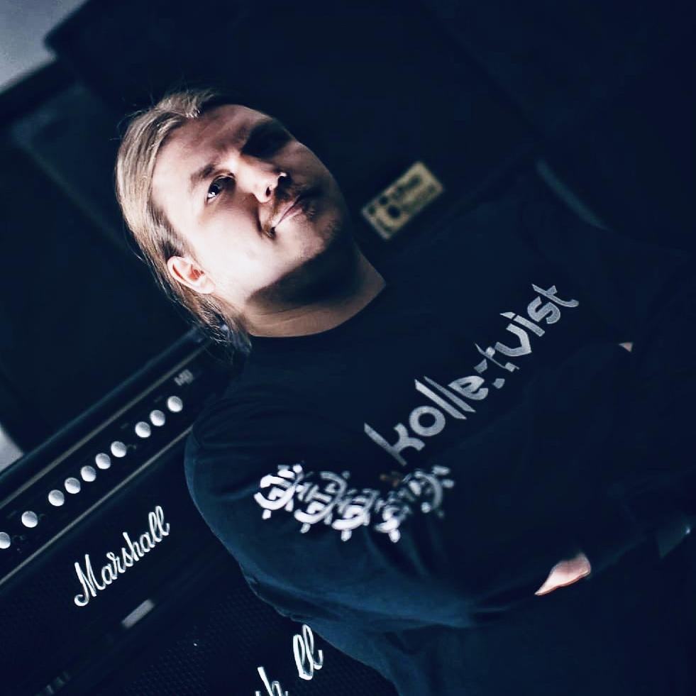 Photo of Vesa standing in front of a Marshall head and cabinet.